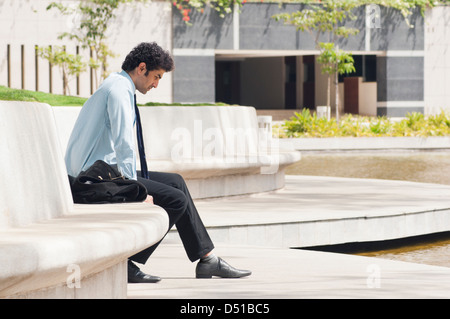 Close-up of a businessman text messaging Stock Photo