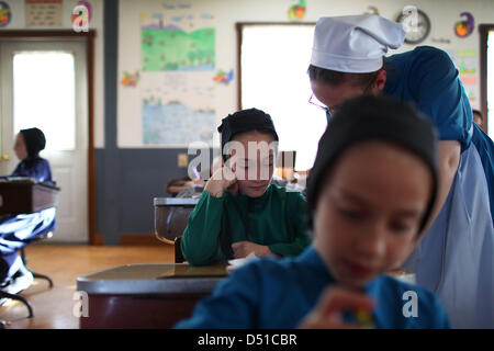 Dec 05, 2012 - Bergholz, Ohio, U.S. - An Amish girl gets help with her arithmetic lesson at thier schoolhouse outside Bergholz, Ohio. (Credit Image: © Michael Francis McElroy/ZUMAPRESS.com) Stock Photo