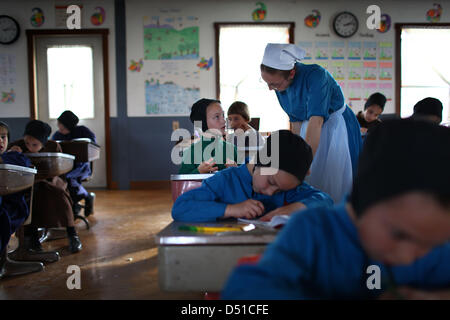 Dec 05, 2012 - Bergholz, Ohio, U.S. - An Amish girl gets help with her arithmetic lesson at the schoolhouse outside Bergholz, Ohio. (Credit Image: © Michael Francis McElroy/ZUMAPRESS.com) Stock Photo