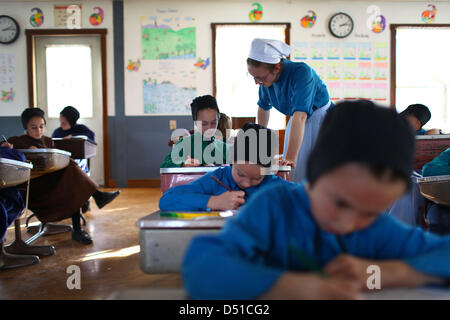 Dec 05, 2012 - Bergholz, Ohio, U.S. - An amish girl gets help from her teacher during a arithmetic lesson. (Credit Image: © Michael Francis McElroy/ZUMAPRESS.com) Stock Photo