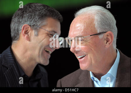 Herbert Hainer (L) executive chairman of the sportswear company adidas AG and FIFA-representative Franz Beckenbauer laugh during the award ceremony of the best players of the FIFA World Cup 2010 at the company headquarters of adidas in Herzogenaurach, Germany, 14 December 2010. Photo: Davis Ebener Stock Photo
