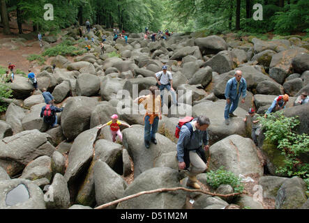 (file) - A dpa file picture dated 16 May 2005 shows people climbing rocks in Lautertal, Germany. The field of rocks is part of a nature park that features trails for hikers and mountain bikers. Photo: Roland Holschneider Stock Photo