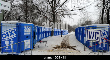 Ready for the crowds to come, loos stand at the edge of the Tiergarten after all preparations for Germany's biggest New Year party are completed in Berlin, Germany, 30 December 2010. About one million visitors are expected to join the party. Photo: Tim Brakemeier Stock Photo