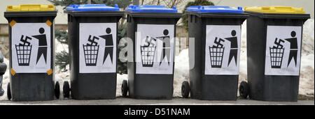 People protest against a federal party meeting of the right-wing party German People's Union (DVU) with anti-neo-Nazi stickers and trash bins in Kirchheim, Germany, 12 December 2010. The association Opferperspektive (Victim's Perspective) comes to the conclusion, that distinctly less people were victims of right-wing-extremist violence in Brandenburg in 2010 than in the years befor Stock Photo