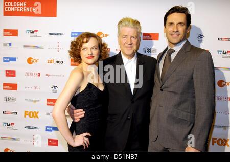 US actors Elisabeth Moss (L) and Jon Hamm (R) and US director David Lynch attend a workshop of the international film and television festival 'Cologne Conference' in Cologne, Germany, 01 October 2010. Photo: Horst Galuschka Stock Photo