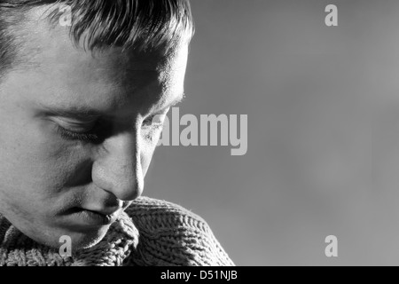 sad man looking down  Stock Photo
