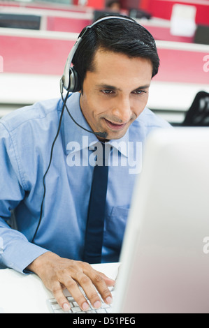 Customer service representative wearing a headset Stock Photo