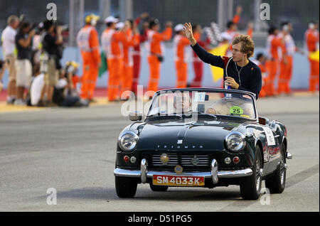 German Red Bull driver Sebastian Vettel takes part in the drivers parade for the Singapore Grand Prix in Singapore, 26 September 2010. Photo: JAN WOITAS Stock Photo