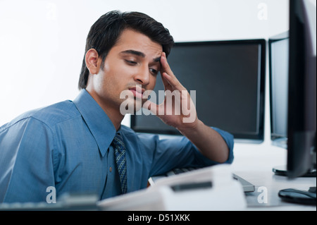 Businessman suffering from a headache Stock Photo