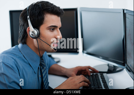 Customer service representative talking on a headset Stock Photo