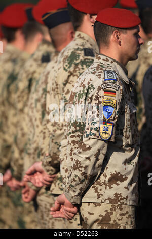 Bundeswehr soldiers stand in line at the Bundeswehr camp in Kundus ...