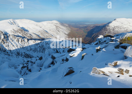 View of Nant Francon from the Glyderau Range on a clear snowy day. Stock Photo