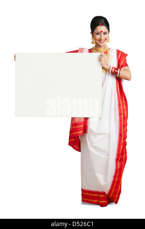Portrait of a woman in Bengali sari holding a whiteboard Stock Photo