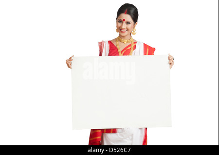 Portrait of a woman in Bengali sari holding a whiteboard Stock Photo