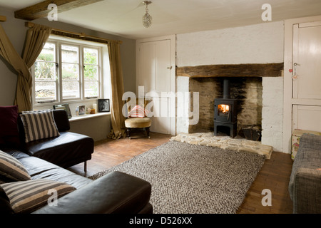 A small cottage living room with period features and modern leather sofa. Stock Photo