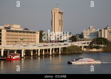 Brisbane River ferry City Cat heading upstream Brisbane Queensland Australia in the late afternoon sunlight. Stock Photo