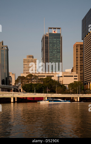 Brisbane River Ferry Citycat passing Brisbane CBD Queensland Australia in the late afternoon. Stock Photo