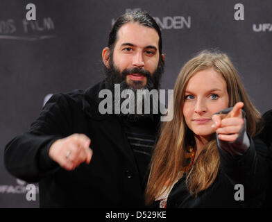 Singer of the band 'We are Heroes' Judith Holofernes and her husband, the drummer Pola Roy attend the premiere of the movie 'The Coming Days' in the Cinestar Cinema at Potsdamer Platz in Berlin, Germany, 27 October 2010. The film will arrive German cinemas on 04 November 2010. Photo: Jens Kalaene Stock Photo