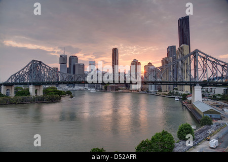 Sunset over the Brisbane River with the Storey Bridge in foreground and Brisbane City in background Stock Photo