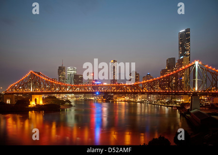 Sunset over the Brisbane River with the Storey Bridge in foreground and Brisbane City in background Stock Photo