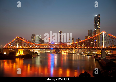 Sunset over the Brisbane River with the Storey Bridge in foreground and Brisbane City in background Stock Photo