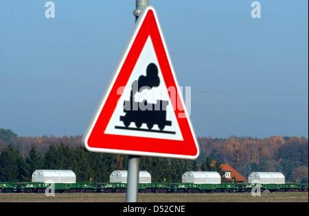 (dpa file) A file picture dated 11 November 2003 of a CASTOR transport passing Oldendorf, Germany. Eleven containers with nuclear waste from nuclear fuel reprocessing plant La Hague are to arrive on 05 November 2010 in Gorleben. A protest that has not been seen in a long time against the CASTOR transport is expected. Photo: Kay Nietfeld Stock Photo