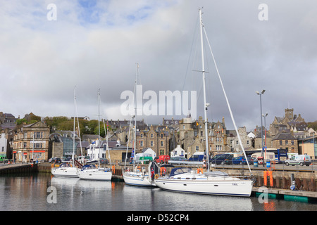 Yachts moored in small boat harbour with old town waterfront buildings in Lerwick, Mainland Shetland Islands, Scotland, UK Stock Photo