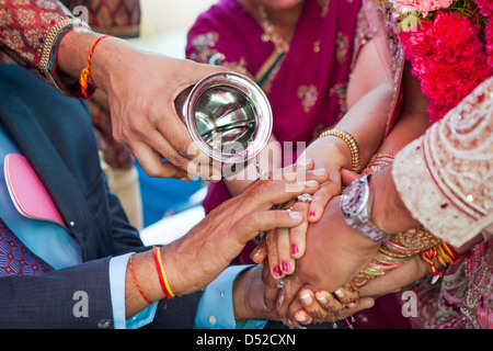 Indian couple performing wedding ceremony Stock Photo