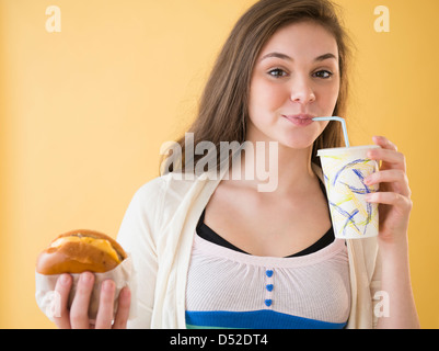 Hispanic girl having fast food Stock Photo