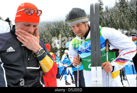 Tobias Angerer (L) and Axel Teichmann of Germany reacts after the men's 4x10 km Relay Cross Country Skiing race at Olympic Park during the Vancouver 2010 Olympic Games in Whistler, Canada, 24 February 2010. Photo: Martin Schutt  +++(c) dpa - Bildfunk+++ Stock Photo