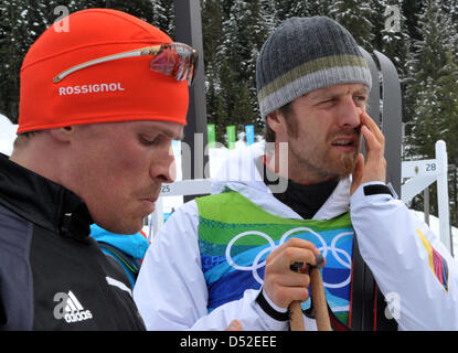 Tobias Angerer (L) and Axel Teichmann of Germany reacts after the men's 4x10 km Relay Cross Country Skiing race at Olympic Park during the Vancouver 2010 Olympic Games in Whistler, Canada, 24 February 2010. Photo: Martin Schutt  +++(c) dpa - Bildfunk+++ Stock Photo