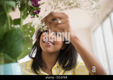 African American woman arranging flowers Stock Photo - Alamy