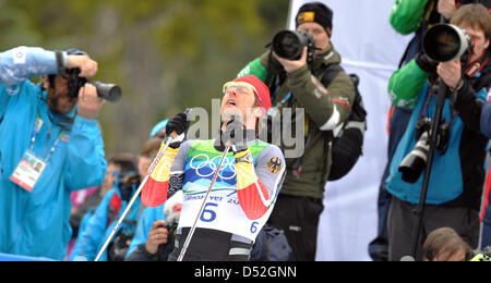 Axel Teichmann of Germany reacts after crossing the finish line the men's 50km Mass Start Cross Country Skiing event at the Vancouver 2010 Olympic Games, Whistler, Canada, 28 February 2010. Teichmann won silver. Photo: Peter Kneffel  +++(c) dpa - Bildfunk+++ Stock Photo