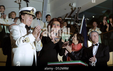 Film-diva Sophia Loren (C), captain Giuliano Bossi (L), France's State Secretary for External Trade Anne-Marie Idrac (2-R) and MSC boss Pierfrancesco Vago during the christening ceremoney of the cruise liner ''MSC Magnifica'' in Hamburg, Germany, 06 March 2010. Sophia Loren is the godmother of the 293 meter long and 32 meter wide swimming hotel. It is the eleventh ship of the MSC-  Stock Photo