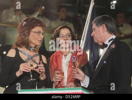 Film-Diva Sophia Loren, France's State Secretary for External Trade Anne Marie Idrac and MSC boss Pierfrancesco Vago talk to each other during the christening ceremoney of the cruise liner ''MSC Magnifica'' in Hamburg, Germany, 06 March 2010. Sophia Loren is the godmother of the 293 meter long and 32 meter wide swimming hotel. It is the eleventh ship of the MSC- cruise liners fleet Stock Photo