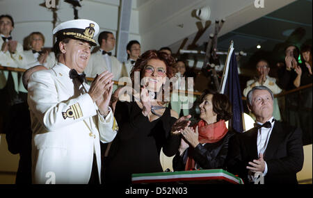 Captain Giuliano Bossi, Film-Diva Sophia Loren, France's State Secretary for External Trade Anne-Marie Idrac and magnate Gianluigi Aponte celebrate the christening of ''MSN Magnifica'' in Hamburg, Germany, 06 March 2010. Sophia Loren is the godmother of the 293 meter long and 32 meter wide swimming hotel. It is the eleventh ship of the MSC- cruise liners fleet. Photo: Ulrich Perrey Stock Photo