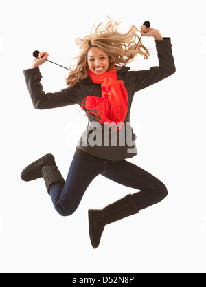 Mixed race woman jumping for joy