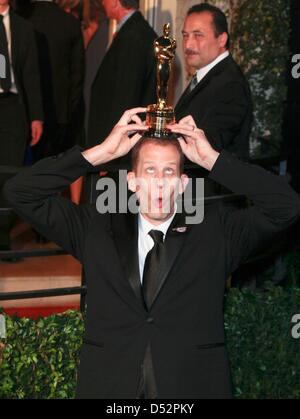 US director Pete Docter poses with the Best Animated Feature Film award for the movie 'Up' at the Vanity Fair Oscar Party at Sunset Tower in Los Angeles, USA, 07 March 2010. Photo: Hubert Boesl Stock Photo