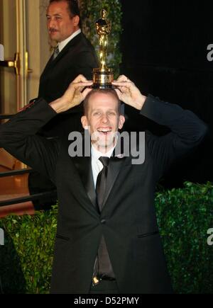 US director Pete Docter poses with the Best Animated Feature Film award for the movie 'Up' at the Vanity Fair Oscar Party at Sunset Tower in Los Angeles, USA, 07 March 2010. Photo: Hubert Boesl Stock Photo