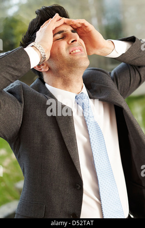 Man stressed out at work Stock Photo
