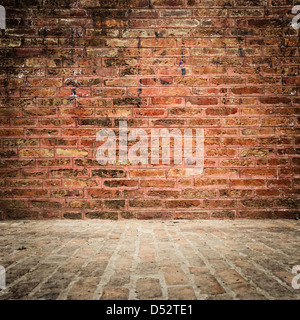 Grungy brick wall and floor with vignette Stock Photo
