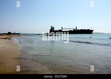 Transport ship in Caribbean beach Stock Photo