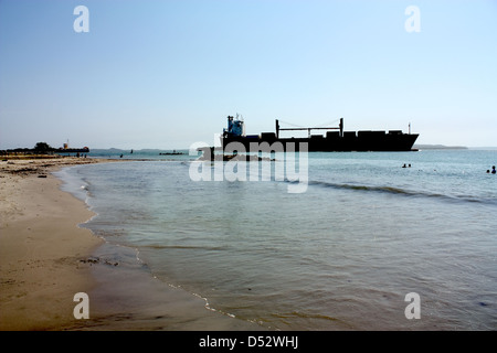 Transport ship in Caribbean beach Stock Photo