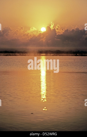 Bright rising sun and sunrise of new year 2025 with shining holy cross ...