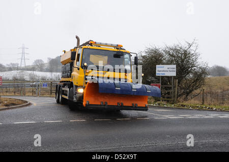 Harelea Cottage, East Renfrewshire, Scotland, UK. 22nd March 2013.  A gritting lorry with plough attachment leaves the operations centre near Glasgow. Many of Scotland's roads have been affected by todays blizzard conditions and the gritters have worked hard to keep traffic moving.. Credit:   / Alamy Live News Stock Photo