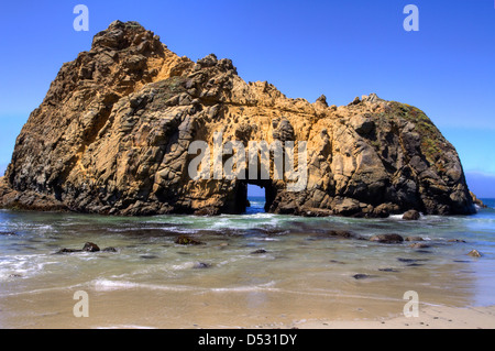 Offshore stack with an arch at Pfeiffer Beach in the Julia Pfeiffer Big Sur State Park, California, USA in January Stock Photo