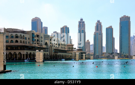 Souk al Bahar and the Skyline of Dubai Downtown, seen across the fountain lake, United Arab Emirates Stock Photo