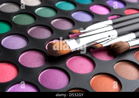 Makeup brushes and shadows Stock Photo
