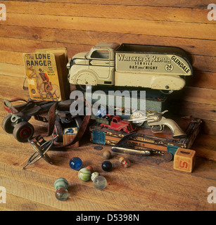Collection of antique toys, trucks, marbles, roller skates, cap gun and Lone Ranger Big Little Book. Lincoln Nebraska NE USA Stock Photo