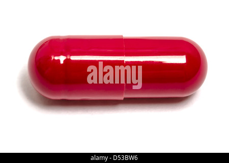 Red capsule isolated on white background Stock Photo